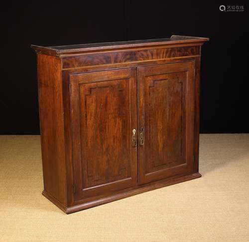 A Georgian Inlaid Oak Bookcase.