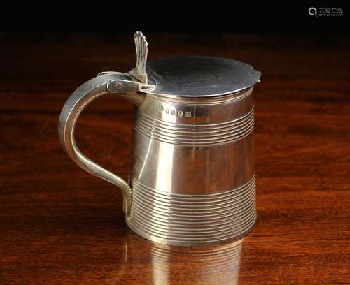 A Georgian Silver Tankard with hinged lid hallmarked London ...