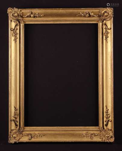 A 19th Century Moulded Gilt Picture Frame decorated with cre...