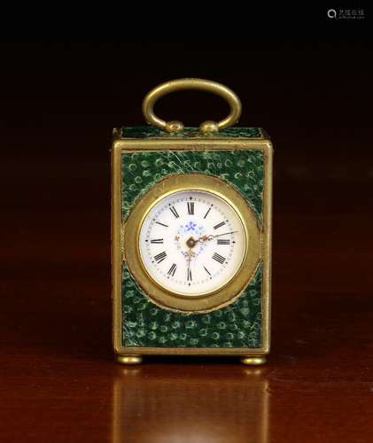 A Miniature Clock in a gilt metal case clad with faux shagre...