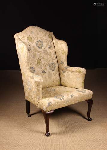 A 19th Century Wing Armchair.