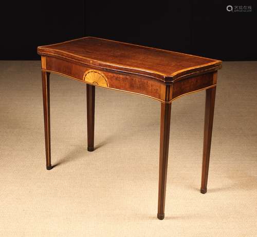 A Fine George III Serpentine Fold-over Card Table.