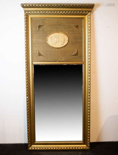 Decorated mirror with integrated medallion