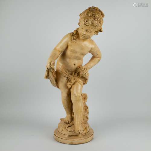 A patinated plaster of a bathing girl