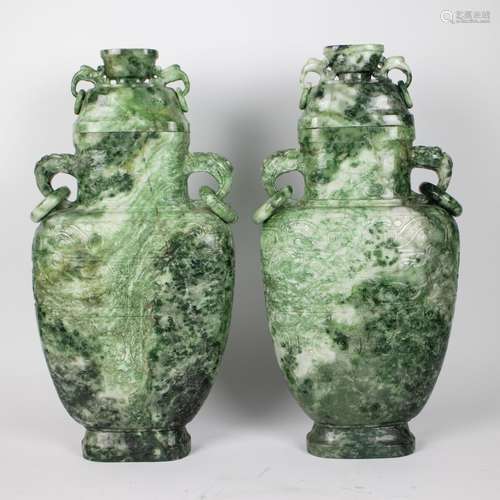 A pair of Chinese lidded vases in natural stone with jade lo...