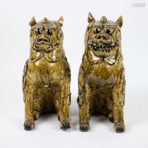 Couple Chinese Foo dogs in glazed pottery