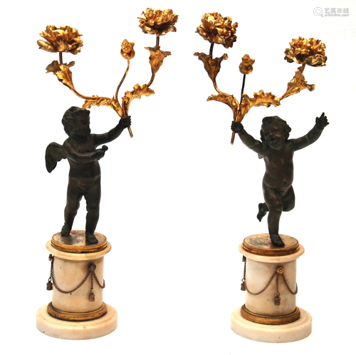 coppia di candelabri in bronzo patinato e dorato ,