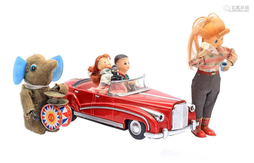 Tin wind-up car with dolls