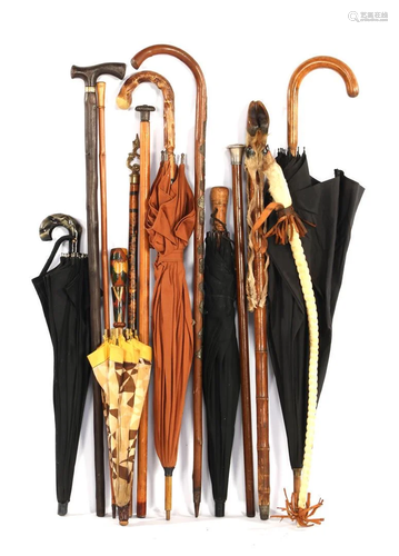 Lot of various old walking sticks and umbrellas