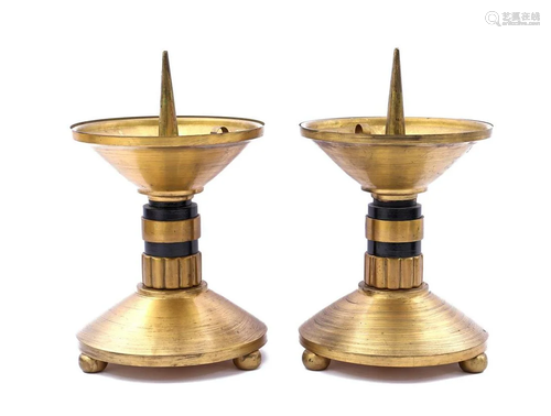 2 brass candlesticks with black rings