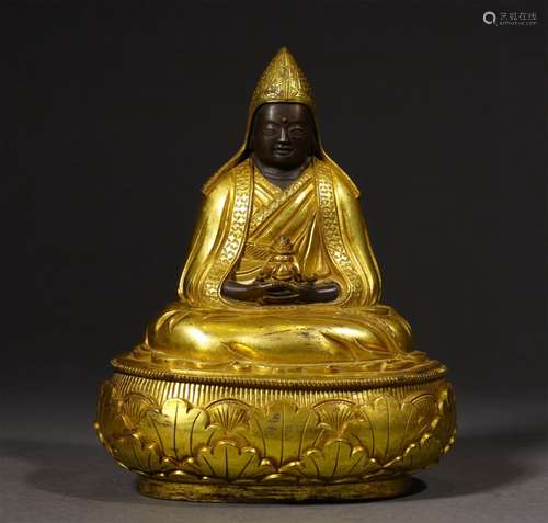 A MING DYNASTY BRONZE GILDED GURU BUDDHA STATUE