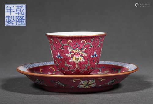 A QING DYNASTY FAMILLE ROSE TANGLED LOTUS CUP AND PLATE