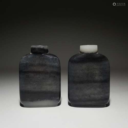 A PAIR OF QING DYNASTY HETIAN BLUE AND WHITE SEED MATERIAL S...