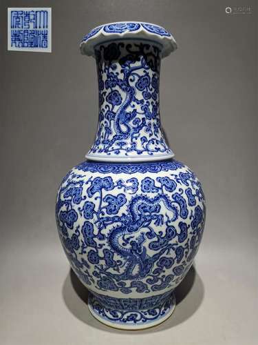 A QING DYNASTY BLUE AND WHITE DRAGON DESIGN KWAI MOUTH ZUN