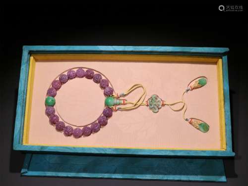 A QING DYNASTY RUBY EIGHTEEN SEEDS HAND STRING