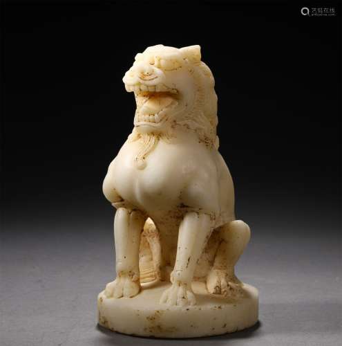 A TANG DYNASTY WHITE JADE LION
