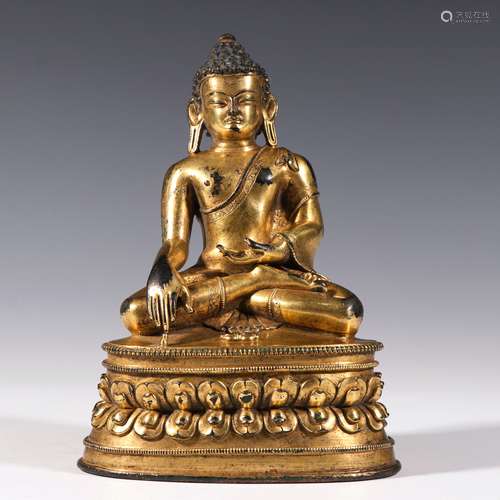 A MING DYNASTY BRONZE GILDING BUDDHA STATUE