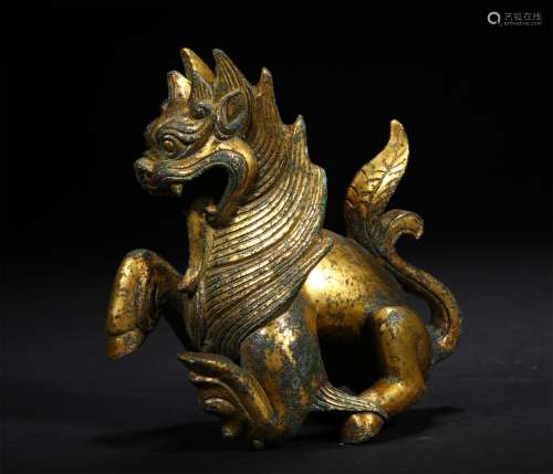 A TANG DYNASTY BRONZE GILDED BEAST