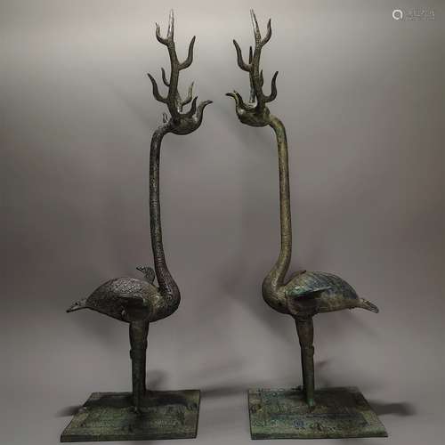 A PAIR OF WARRING STATES PERIOD BRONZE ANTLER AND CRANES ORN...