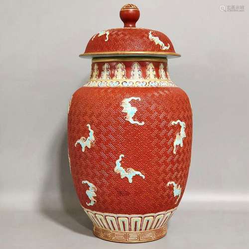 A QING DYNASTY CORAL RED GLAZE CARVED BATS COVERED JAR