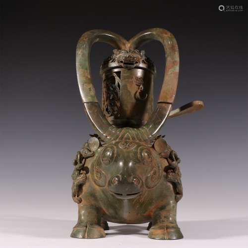 A WARRING STATES PERIOD BRONZE OX LAMP ORNAMENT