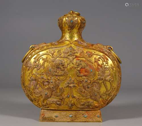 A TANG DYNASTY BRONZE GILDING FRIED BEAD FLAT BOTTLE