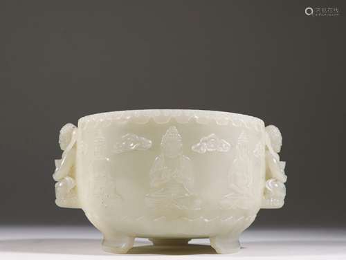 A QING DYNASTY HETIAN JADE CARVED BUDDHA TRIPOD INCENSE INSE...