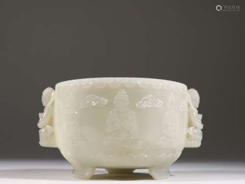 A QING DYNASTY HETIAN JADE CARVED BUDDHA TRIPOD INCENSE INSE...