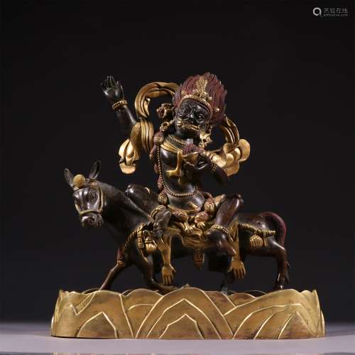 AN OLD BRONZE GILDED TREASURE GOD STATUE