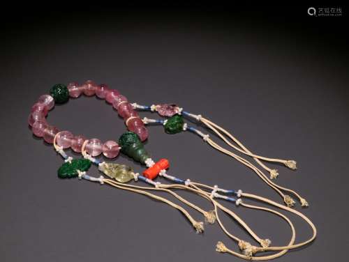 A STRING OF QING DYNASTY TOURMALINE EIGHTEEN BEADS HAND STRI...