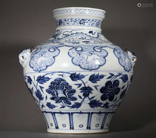 A YUAN DYNASTY BLUE AND WHITE TANGLED LOTUS BEAST EARS JAR