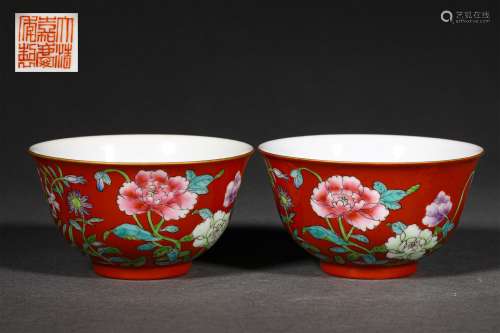 A PAIR OF QING DYNASTY FAMILLE ROSE RED GROUND FLOWER CUPS