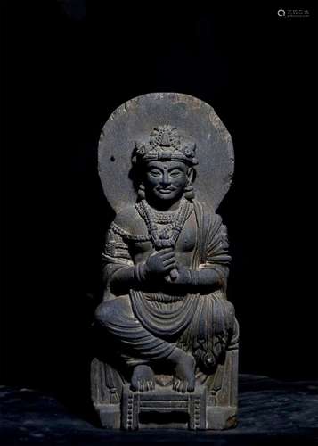 A GANDHARA GRAY SCHIST SITTING STATUE