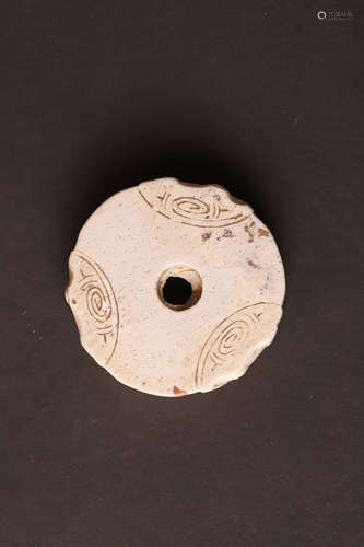 A Liangchu Jade Round Bi Ornnament