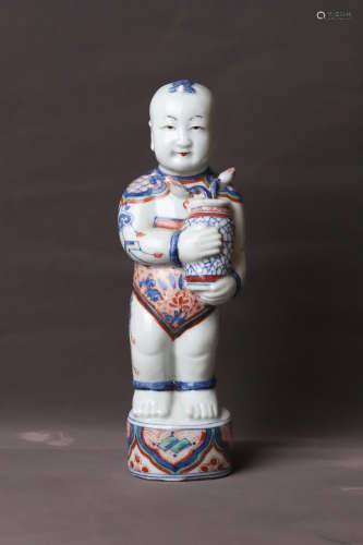 A Porcelain Child Figure Statue
