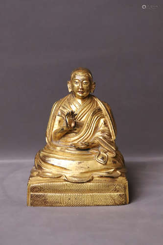 A Gilt Bronze Seated Guru Figure Statue