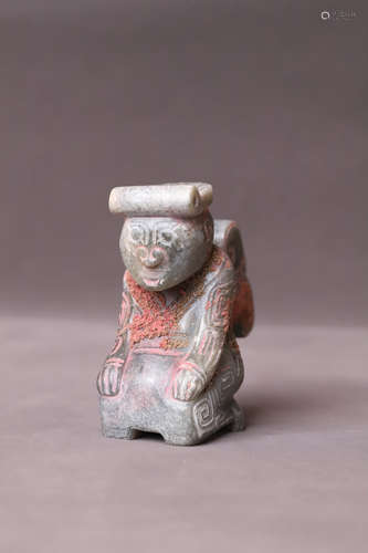 A Carved Kneeling Man Figure Statue