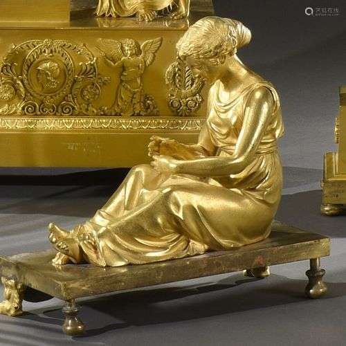 Sujet en bronze doré, représentant une jeune femme assise le...