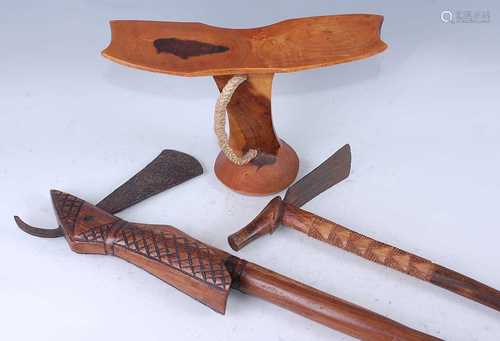 An African two-tone hardwood headrest, having a shaped dishe...