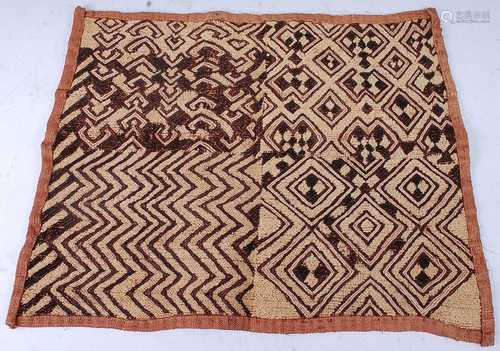 A raffia cloth, woven as four geometric panels, within a fur...