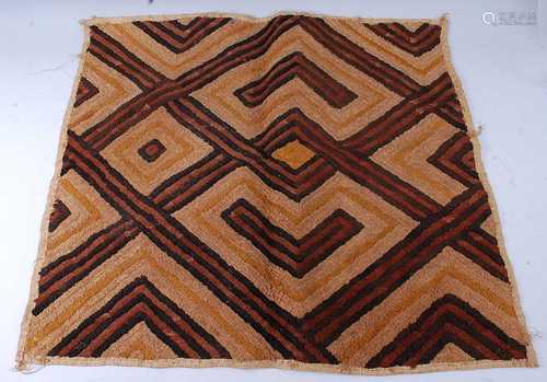 A raffia cloth, woven with a lattice work design in brown an...