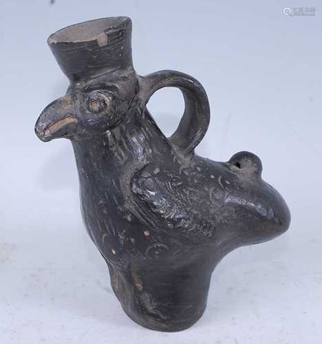 A blackware pottery vessel in the form of a bird, having nat...