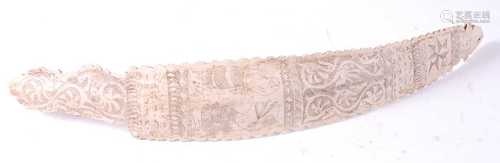 * An animal bone divination wand, the centre carved with sna...