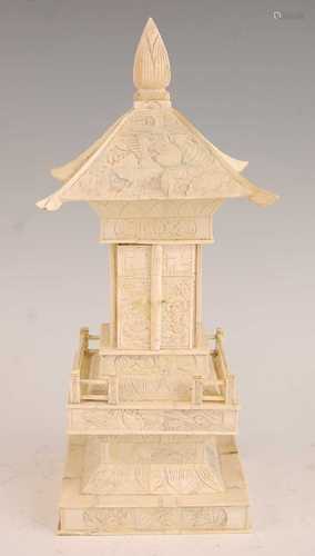 * A sectional carved bone Buddhist shrine in the form of a t...