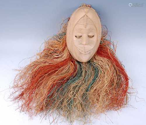 A carved wooden African dance mask, having a woven fibre sku...