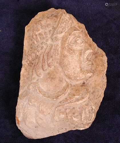 * A Greco-Roman marble fragment, carved as a male in profile...