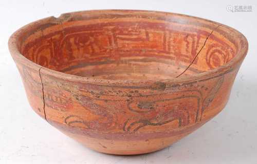 * A redware pottery bowl, the exterior frieze polychrome dec...