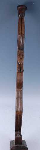 An African ceremonial staff type figure, carved as a female ...