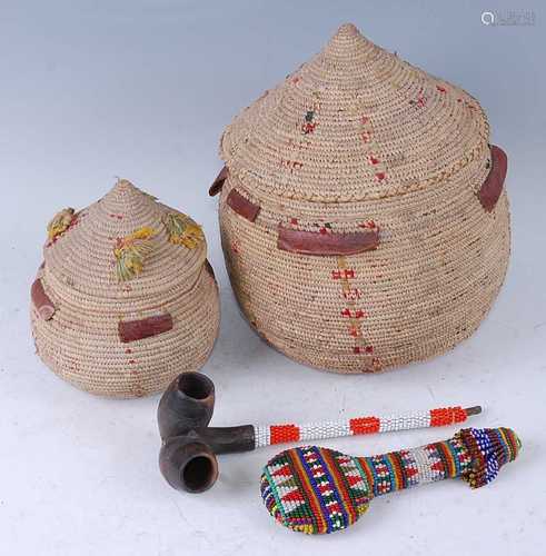 An African pipe, having two bowls to a single stem with appl...