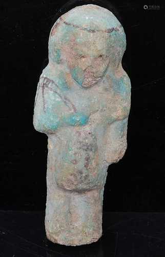 An Egyptian brush decorated green glazed faience shabti, mod...